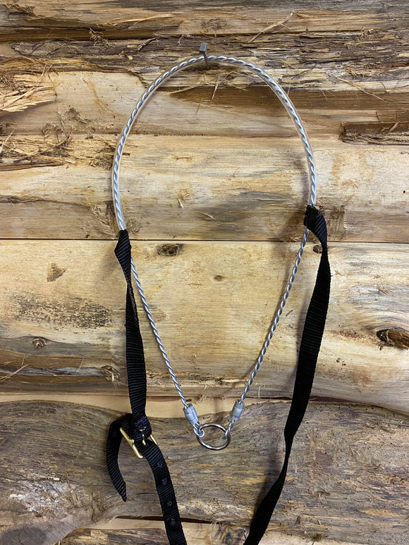 Horse size twisted wire tiedown with clear plastic covered noseband with black nylon head piece. Made by L&W