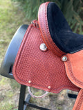 New 16 inch Pro Rider saddle with 7 inch gullet, waffle tooling, worm border, black suede seat