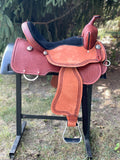 New 16 inch Pro Rider saddle with 7 inch gullet, waffle tooling, worm border, black suede seat